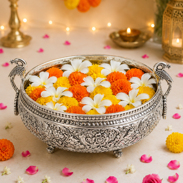 Silver Peacock Handle Urli | Engraved Floral Brass Bowl for Pooja & Festive DécorSilver Peacock Handle Urli | Engraved Floral Brass Bowl for Pooja & Festive Décor